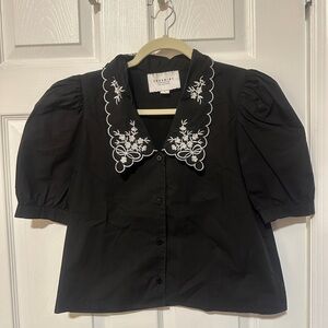 The Shirt by Rochelle Behrens Black Blouse with White Embroidery